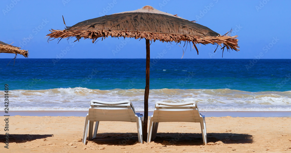 deck chair on a paradise beach