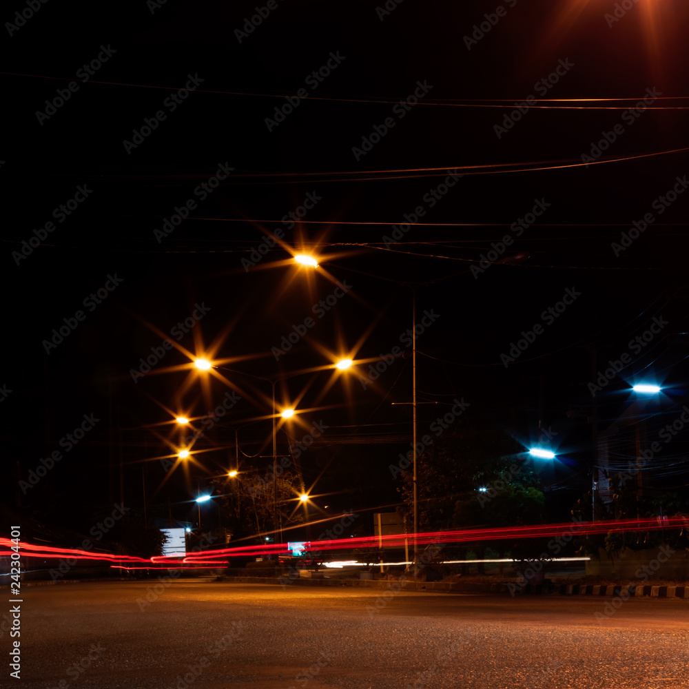 Car headlights and night street lamps.
