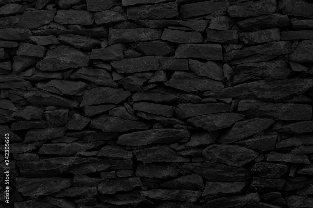 Fototapeta premium Black stone wall background, rock texture in natural pattern with high resolution for design art work.