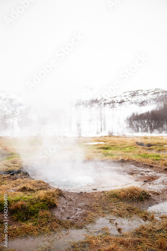 Steam Rising From Geothermal Pools In Icelandic Countryside