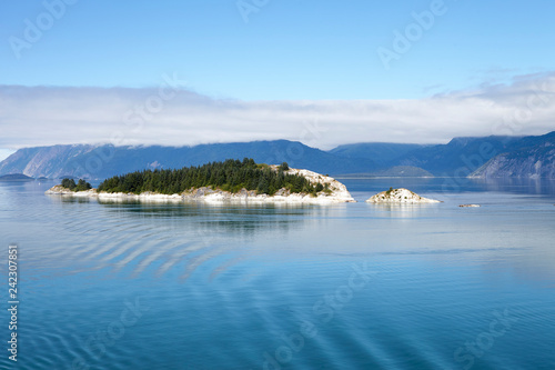 Forested Island On Lake In Alaska Surrounded By Mountains
