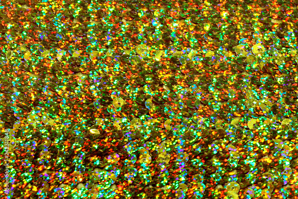 Holographic iridescent round confetti and tinsel background Holographic iridescent round confetti and tinsel background
