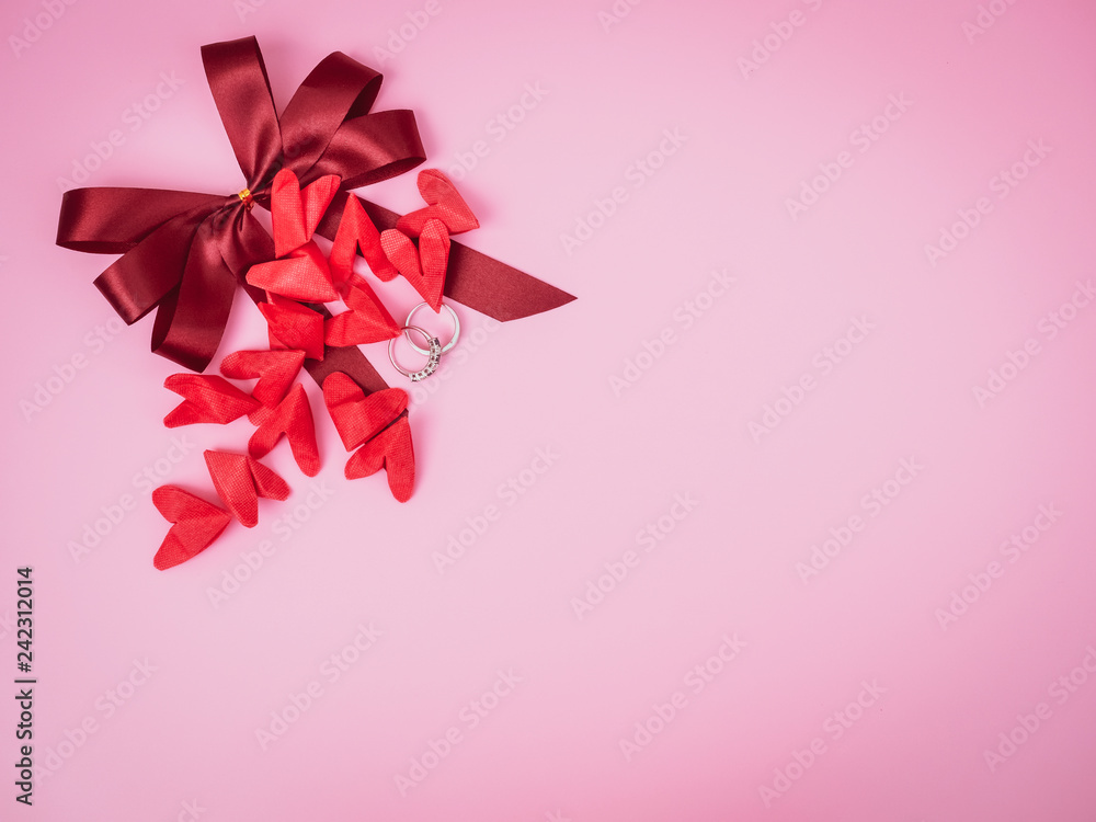 design and decoration for love object in valentine's day concept from flat lay and minimal red paper heart and wedding ring decorate in pink pastel background design and decoration for love object in valentine's day concept from flat lay and minimal red paper heart and wedding ring decorate in pink pastel background