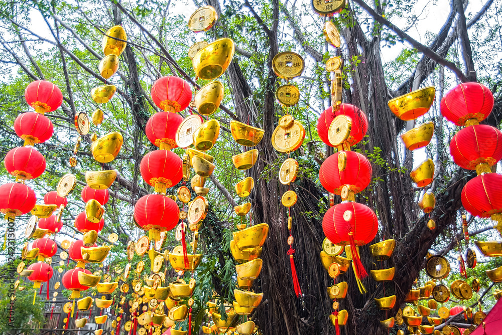 High red lanterns and gold ingots hanging on the tree / Chinese New Year background material High red lanterns and gold ingots hanging on the tree / Chinese New Year background material
