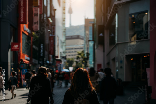 Photography Young asian woman traveler traveling and shopping in Myeongdong street market at Seoul, South Korea