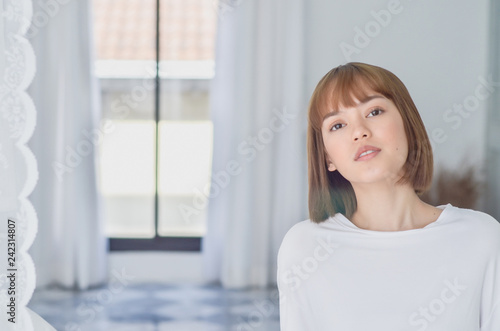 Free Download women sit at the edge of the bed. And stretching his arms to relax in the morning.Wake up in the morning.Warm tone.Do not focus on the object. - GFXLoad