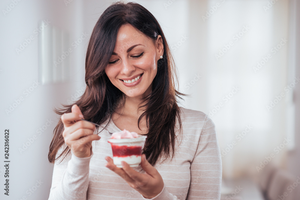 Beautiful woman with creamy dessert. Beautiful woman with creamy dessert.