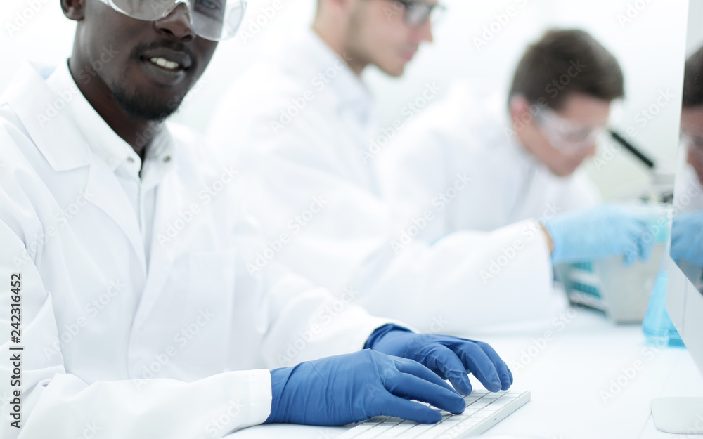 background image of a group of scientists at the laboratory table background image of a group of scientists at the laboratory table