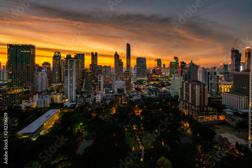 Aerial view of Bangkok skyline and skyscraper with sunset sky on Sukhumvit road center of business in Bangkok city downtown Thailand.
