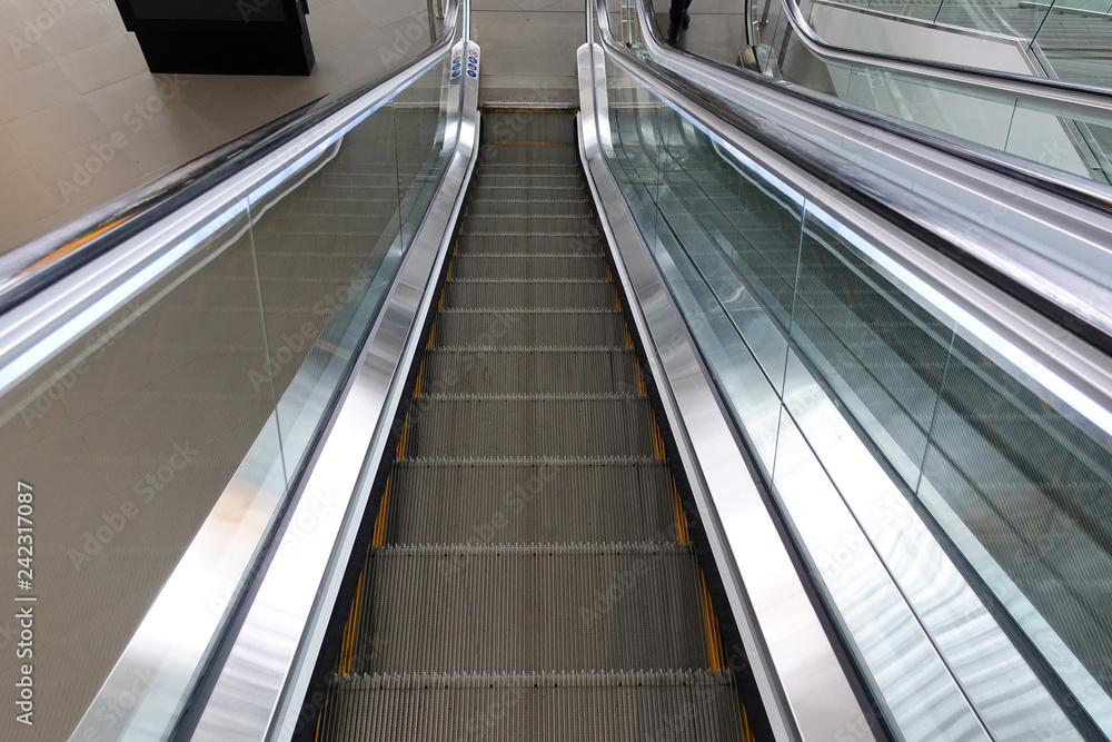 Image of escalator without people. Giving the sensation of movement of the ladder. Image of escalator without people. Giving the sensation of movement of the ladder.