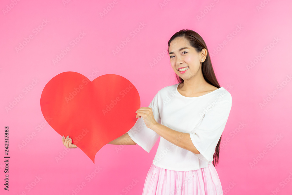 valentine day concept. Beautiful smiley asia girl with pink background copy space isolated. valentine day concept. Beautiful smiley asia girl with pink background copy space isolated.
