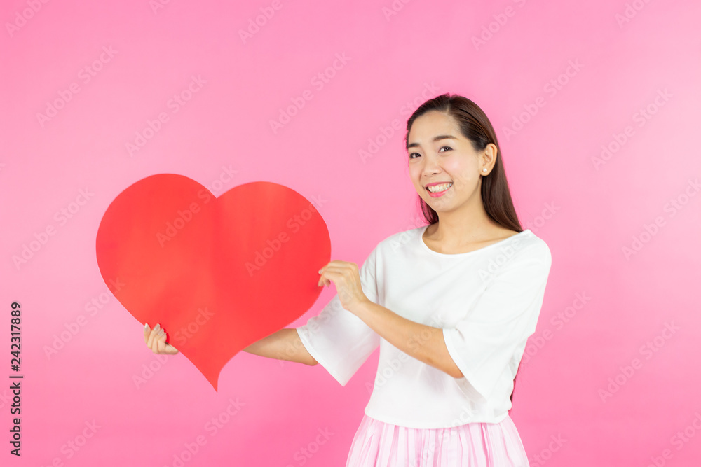 valentine day concept. Beautiful smiley asia girl with pink background copy space isolated. valentine day concept. Beautiful smiley asia girl with pink background copy space isolated.