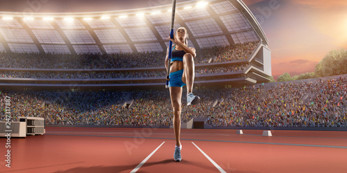 Fototapeta Młoda kobieta sportowiec skoku o tyczce z drążkiem w linii startowej. Kobiety w strojach sportowych na torze sportowym w profesjonalnym stadionie