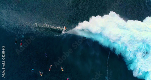  surfing in aerial view, teahupoo papeete french polynesia photo