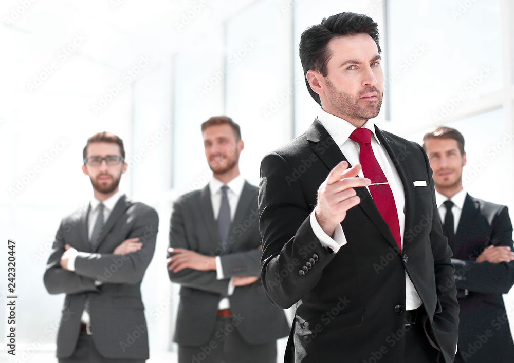 serious businessman standing in the office serious businessman standing in the office