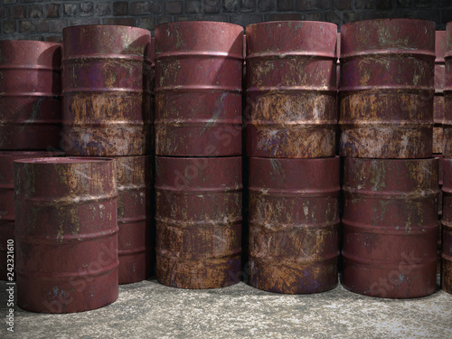 Pile of old rusty metal barrels