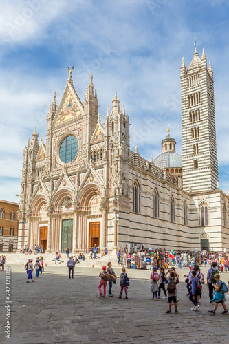 Piazza del Duomo with a school class at the Cathedral of Siena, Italy