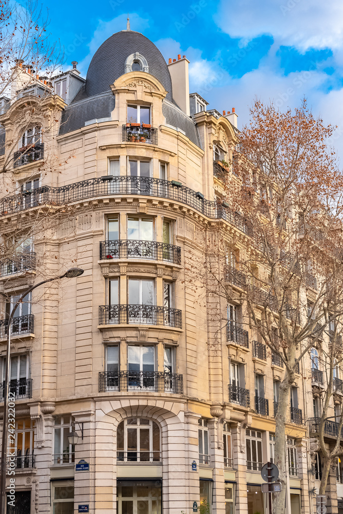 Paris, beautiful building in winter, typical parisian facade in the Marais 