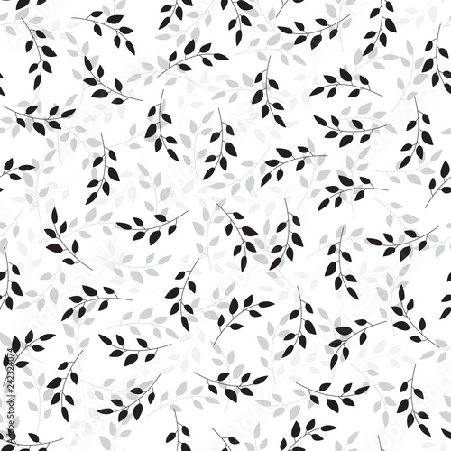 Illustration of sprigs arranged irregularly in shades of black and gray. Stylish repeating graphic pattern with plant silhouettes. Vector seamless pattern great for fabric. Surface repeat design.