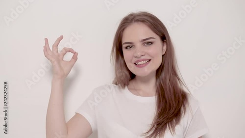 Wallpaper Mural Young woman posing and smiling over white background Torontodigital.ca