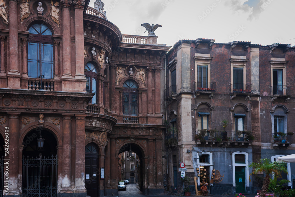 Travel to Italy -  historical street of Catania, Sicily, facade of ancient buildings.