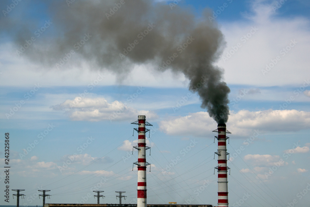 Smoke from a chamney on cloudy sky background Smoke from a chamney on cloudy sky background
