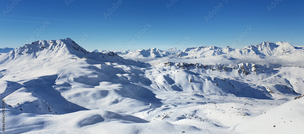 beautiful view on alpine french snowy peak mountain under blue sky