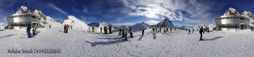winter skiers and Alps landscape 