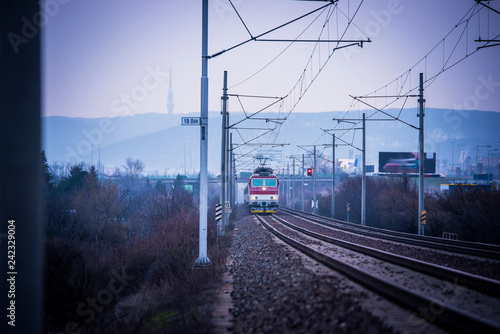 Train ride on the track in dark evening light, travel, transport photo