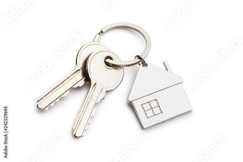 House keys with house shaped keychain, isolated on white background photo