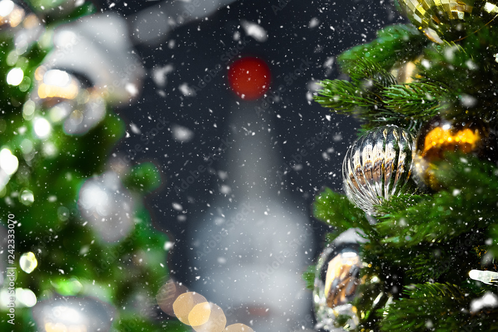 Close up of stylish Christmas tree toys and garland lights on branches. Close up of stylish Christmas tree toys and garland lights on branches.