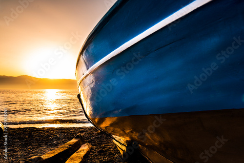 fishing boats along the seafront of Reggio Calabria at sunset photo