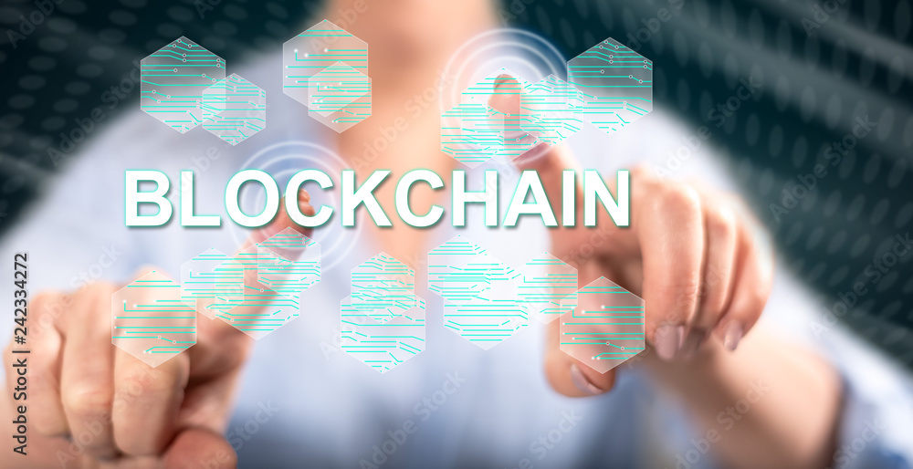 Obraz premium Woman touching a blockchain concept