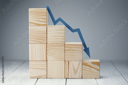 Falling graph on wooden cubes, on neutral background