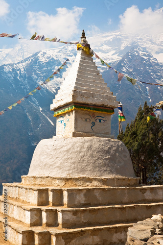 Buddhist stupa with prayer flags in front of the mount Kongde Ri