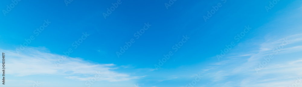Small white clouds and blue sky