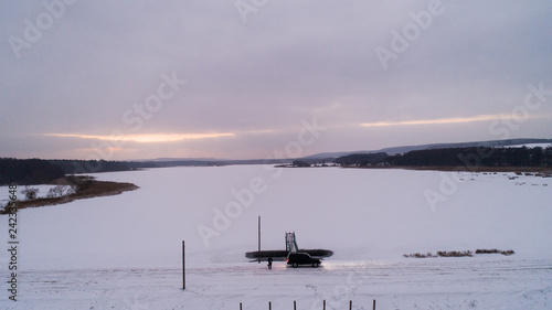 Oval dam on the lake in winter, Ukraine, Rivnenska region photo