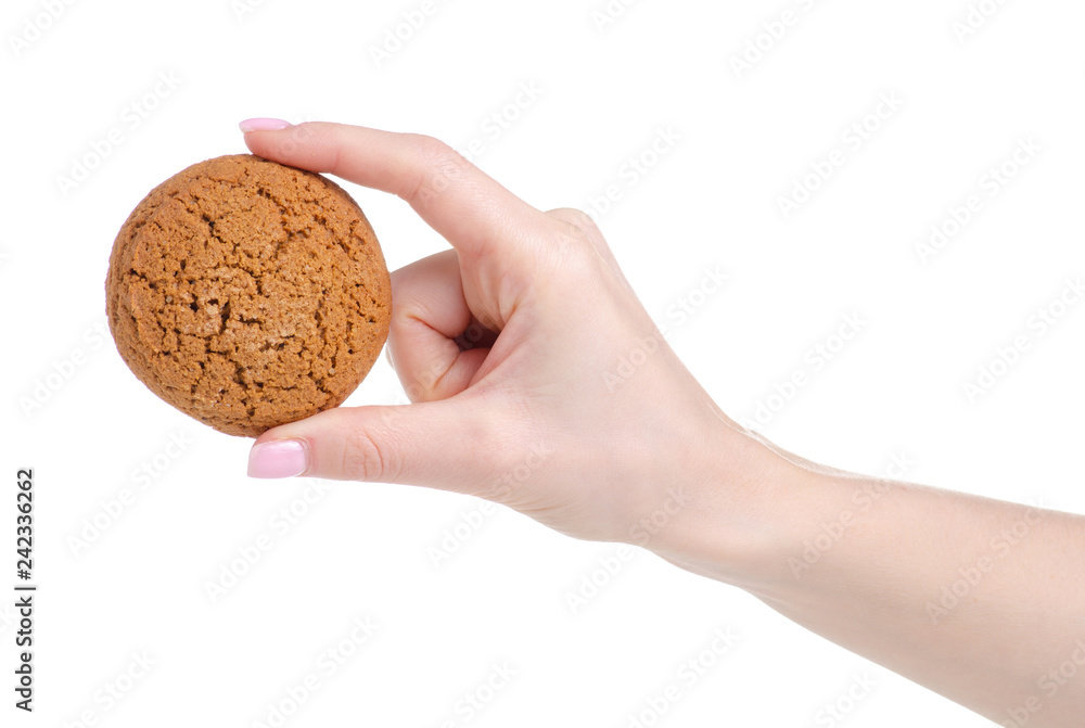 Fototapeta premium Oatmeal cookies in hand on a white background isolation.