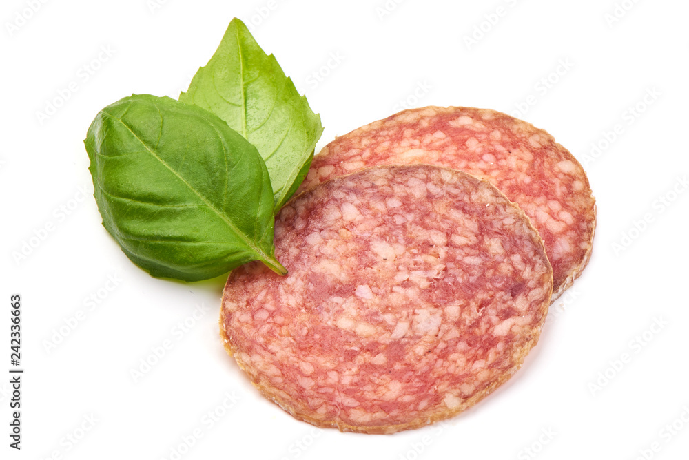 Thinly Sliced Salami with basil leaves, isolated on a white background. Close-up Thinly Sliced Salami with basil leaves, isolated on a white background. Close-up