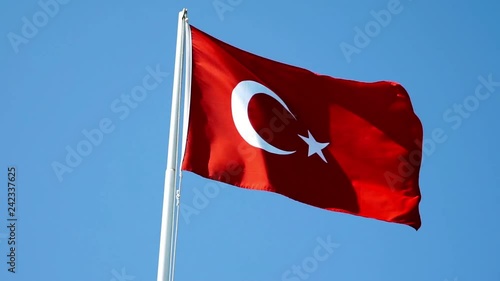 Turkey national flag fluttering against blue sky