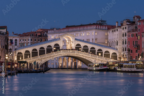 Rialto bridge and Grand Canal at night in Venice, Italy.