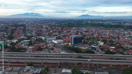 JAKARTA, Indonesia - January 02, 2019: Aerial view of Becakayu toll road with dense residential housing background in Jakarta, Indonesia. Shot in 4k resolution photo