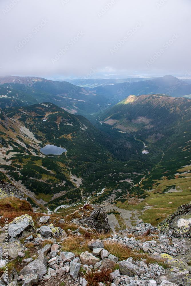 rocky Tatra mountain tourist hiking trails under blue sky in Slovakia