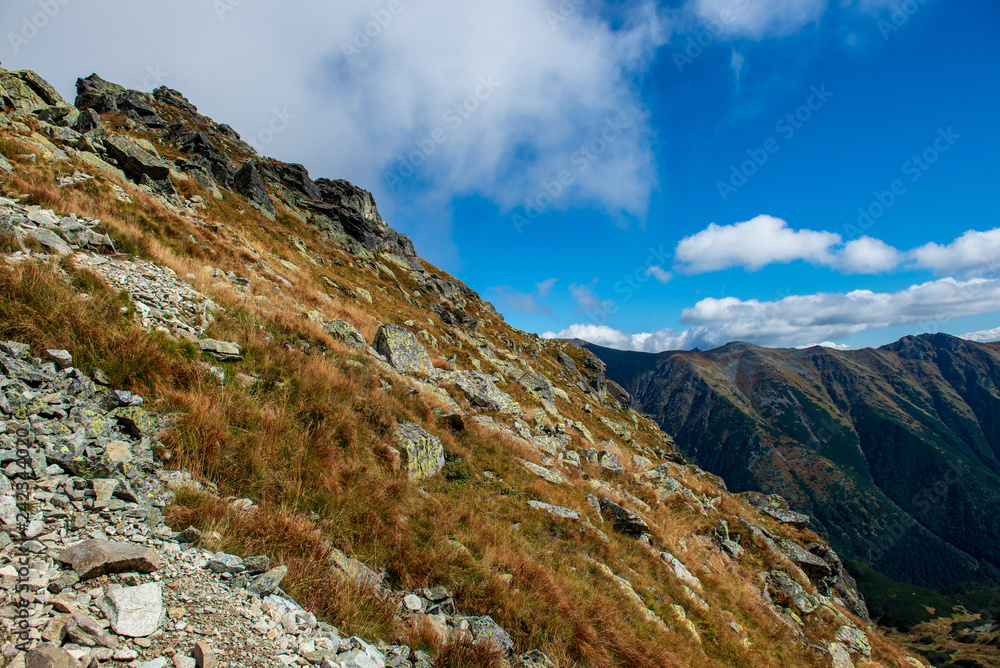 rocky Tatra mountain tourist hiking trails under blue sky in Slovakia rocky Tatra mountain tourist hiking trails under blue sky in Slovakia