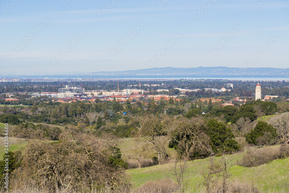 Fototapeta premium View towards Stanford campus and Hoover tower, Palo Alto and Silicon Valley from the Stanford dish hills, California