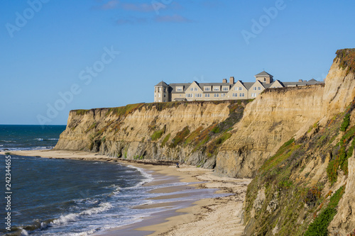Resort on top of eroded cliffs and sandy beach, Pacific Ocean, Half Moon Bay, California