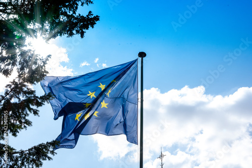 ANNECY, France - September 7 2018:European flag waving near Lac d'Annecy. Located in the Auvergne-Rhône-Alpes region in southeastern France, Annecy is often called the Venice of the Alps