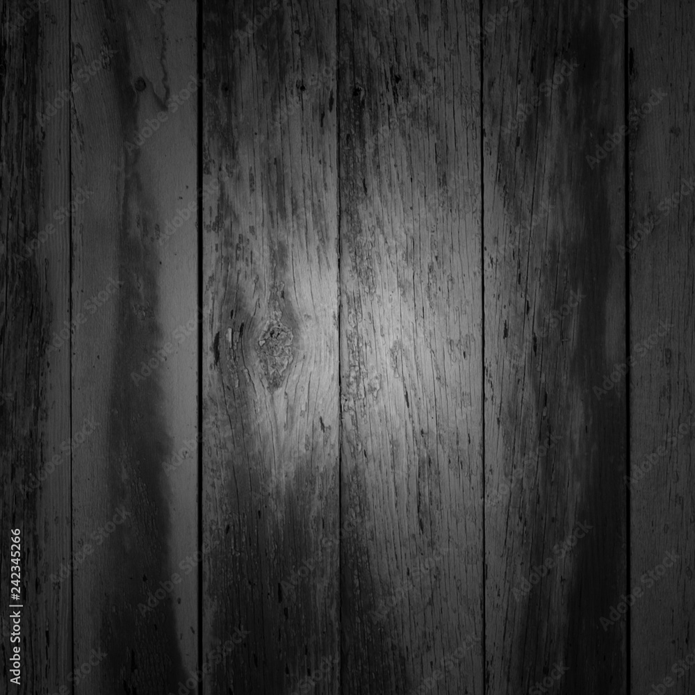 black and white old shabby vertical planks with stains, grunge, texture, background with vignetting 