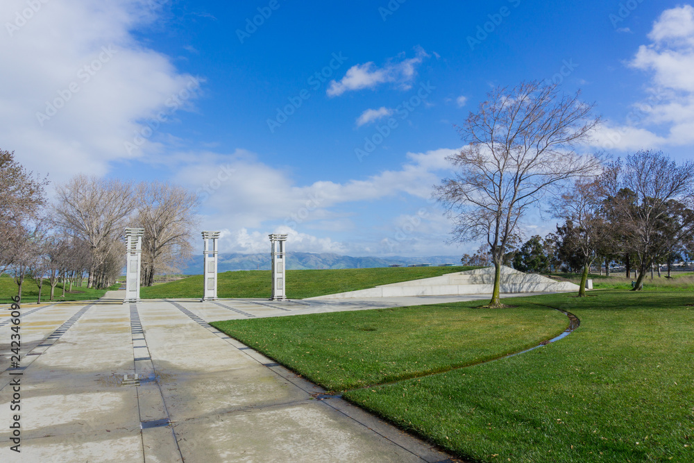 Paved path and art installation in Sunnyvale Baylands Park; Mission Peak in the background south San Francisco bay, California