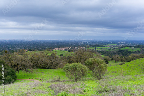 Meadow and hills on a cloudy and rainy day in Rancho San Antonio county park  San Jose and Cupertino in the background  south San Francisco bay  California